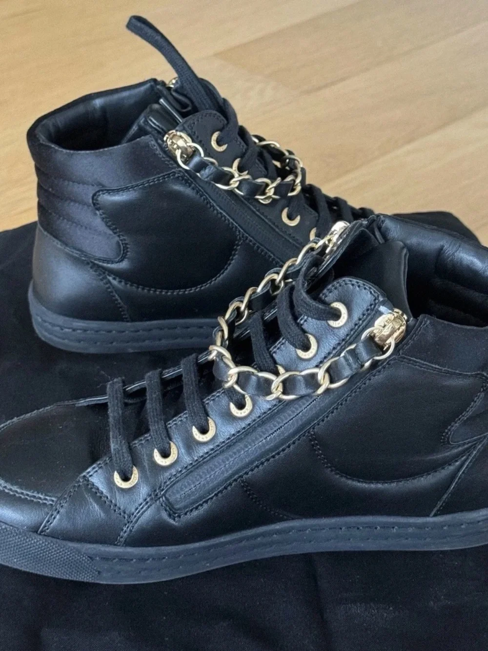 CHANEL Black Quilted High-Top Leather Sneakers with Gold Hardware